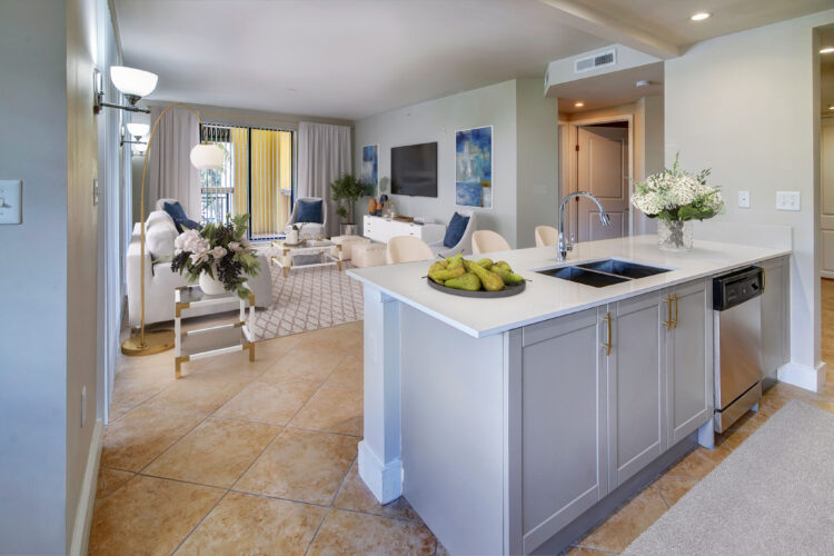 Open-concept living room and kitchen island at Heritage at Boca Raton