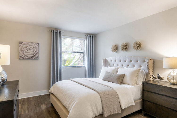 Bright apartment bedroom with window at Heritage at Boca Raton