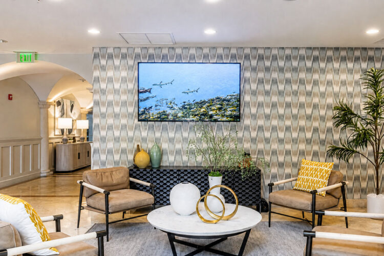 Lobby seating area with accent wall at Heritage at Boca Raton