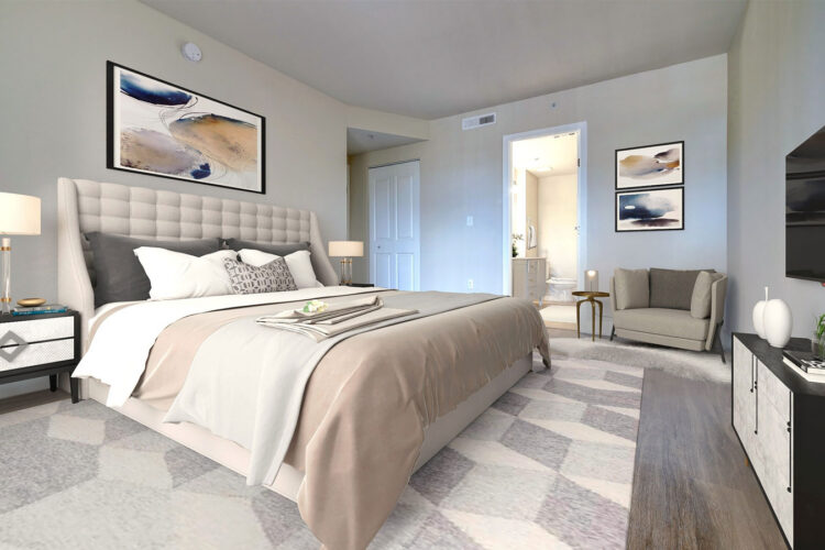 Apartment bedroom with upholstered headboard at Heritage at Boca Raton