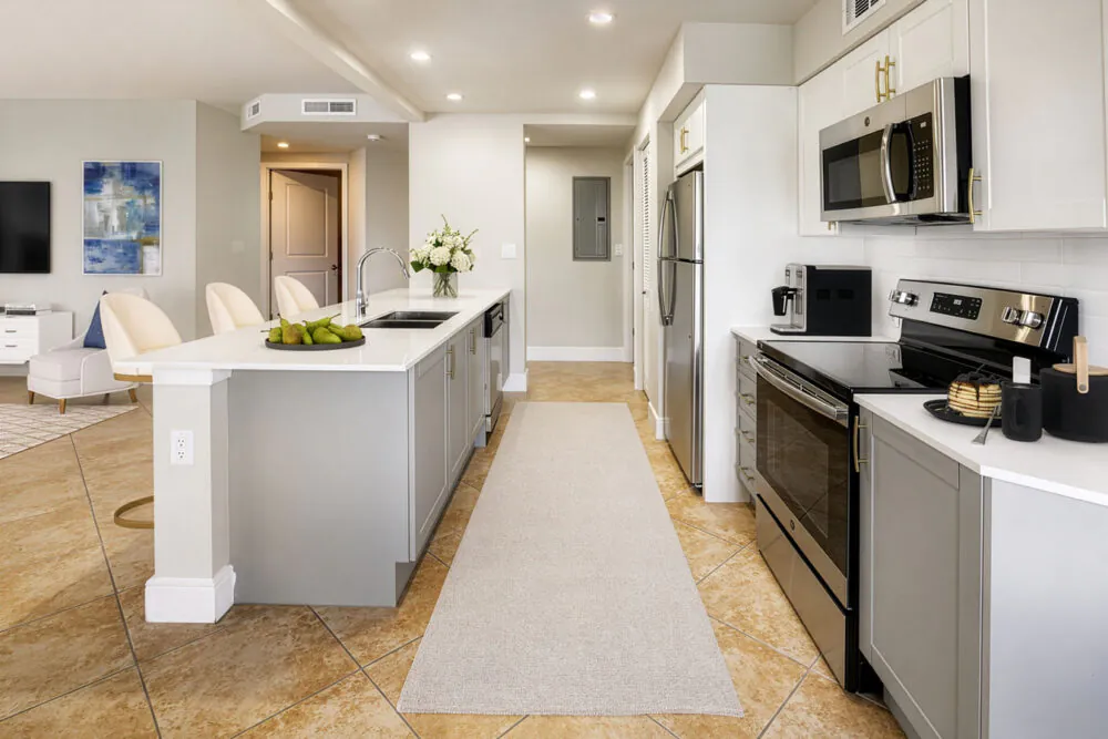 Modern apartment kitchen with island and stainless steel appliances