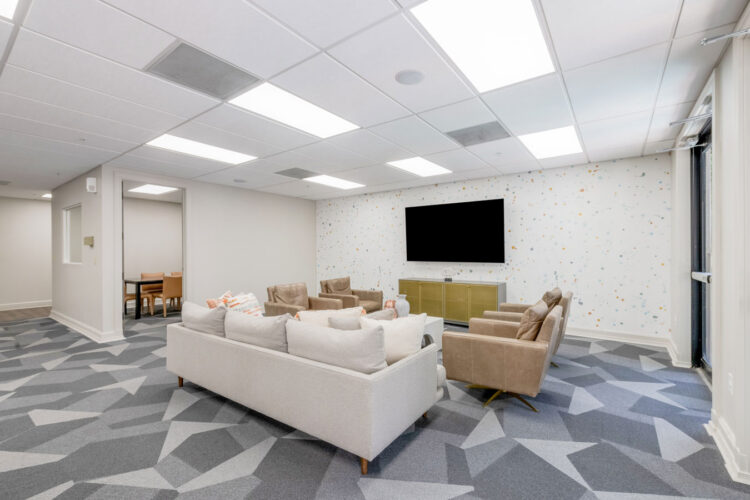 Clubhouse seating area with TV at Heritage at Boca Raton